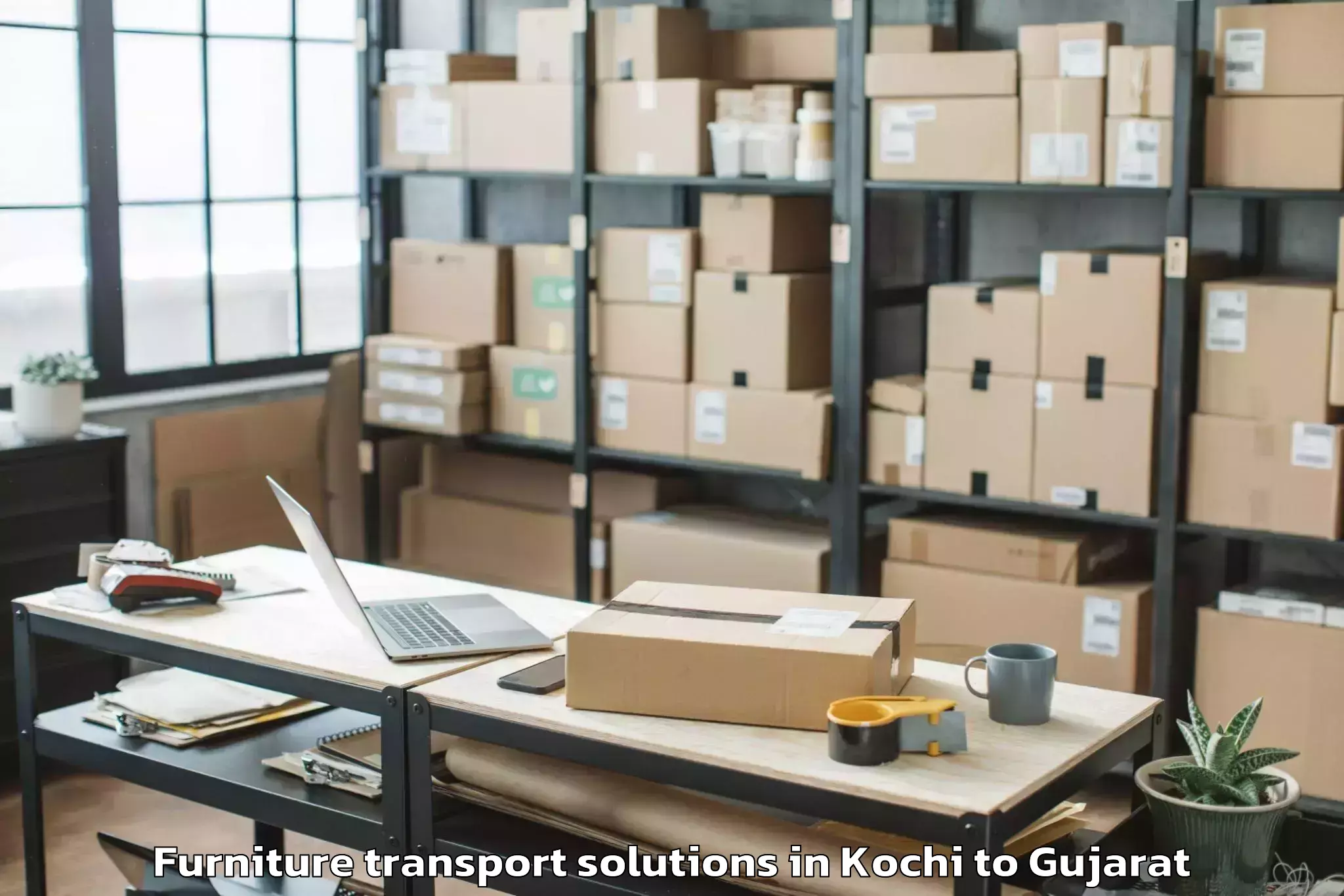 Kochi to Dhoraji Furniture Transport Solutions